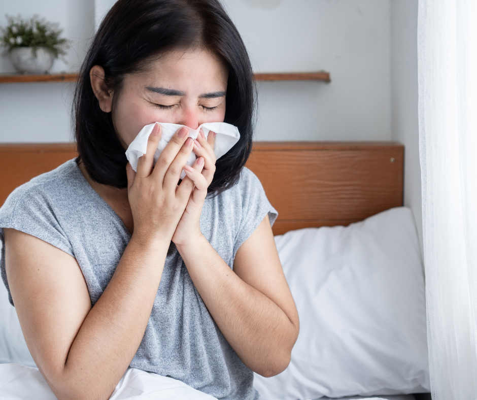 woman blowing her nose