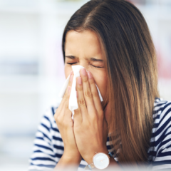 woman sneezing