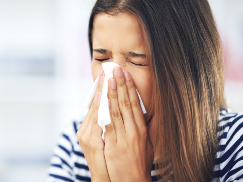 woman sneezing